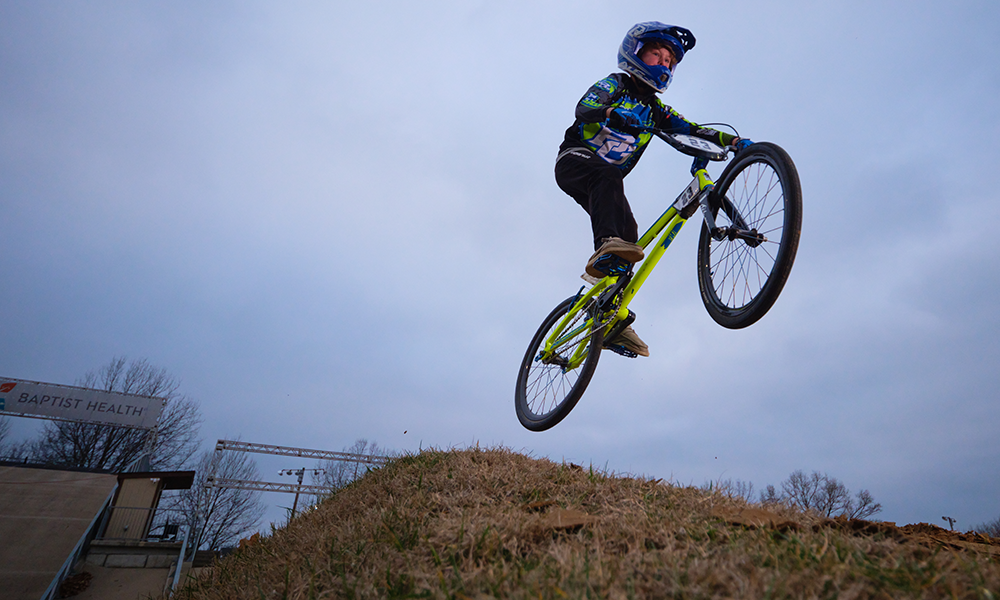 Liam Atherton, who recovered from Langerhans cell histiocytosis, takes a jump on a BMX course.